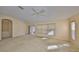 Spacious living room with neutral walls, carpet flooring, and natural light at 1171 Corinth Greens Dr, Sun City Center, FL 33573