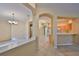Open-concept home with a spacious living area and seamless flow to the kitchen at 1171 Corinth Greens Dr, Sun City Center, FL 33573