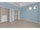 Inviting bedroom with ample closet space and natural light from the windows at 1205 Huntington Greens Dr, Sun City Center, FL 33573