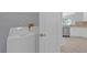 Convenient laundry area with modern appliances and easy access to the kitchen at 1205 Huntington Greens Dr, Sun City Center, FL 33573