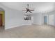 Open-concept living space with neutral paint, tile flooring, and easy access to kitchen and other rooms at 1205 Huntington Greens Dr, Sun City Center, FL 33573