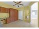 Versatile office space with built-in desk and storage, leading to the bathroom and hallway at 1205 Huntington Greens Dr, Sun City Center, FL 33573