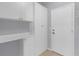 Ample storage space in the room featuring white cabinetry and shelving at 1205 Huntington Greens Dr, Sun City Center, FL 33573