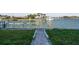 Wide open waterfront view from home, with lush green grass at 13 Bellevue Dr, Treasure Island, FL 33706