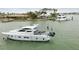 Waterfront property featuring lush tropical landscaping and private boat dockage for yachts and other vessels at 13 Bellevue Dr, Treasure Island, FL 33706