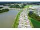An aerial view of homes in a community neighborhood, interspersed with ponds, landscaping and green spaces at 1409 Tropical Oasis Ave, Plant City, FL 33565