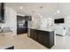 Open kitchen featuring a large island with bar seating, stainless steel appliances, and sightlines to the living area at 1409 Tropical Oasis Ave, Plant City, FL 33565