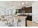 Modern kitchen featuring a granite island with seating and stainless steel appliances at 1409 Tropical Oasis Ave, Plant City, FL 33565