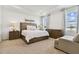 Spacious main bedroom with ample natural light, carpet floors, and modern furnishings at 1409 Tropical Oasis Ave, Plant City, FL 33565