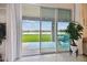 Seamless indoor-outdoor living with sliding glass doors to the patio and stunning water views at 1409 Tropical Oasis Ave, Plant City, FL 33565