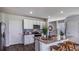 Bright kitchen with a large island, stainless steel appliances, and stylish backsplash at 17007 Barnwood Pl, Lakewood Ranch, FL 34211
