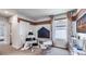 Bright playroom area with a black and white teepee tent, chalkboard and seating, and a light-filled window at 17007 Barnwood Pl, Lakewood Ranch, FL 34211