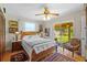 A lovely bedroom with hardwood floors, a large window, and a sliding glass door at 17119 Rainbow Ter, Odessa, FL 33556
