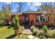 Front view showcasing the home's entrance with detailed landscaping and a charming walkway at 17119 Rainbow Ter, Odessa, FL 33556