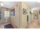 Bright hallway with beautiful wood floors and stylish decor at 17119 Rainbow Ter, Odessa, FL 33556