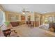 Charming living room with a vintage area rug, antique furniture, and bright, open spaces at 17119 Rainbow Ter, Odessa, FL 33556