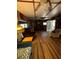 Open concept living room with wood floors, beamed ceilings, and natural light at 17233 Dalberg Dr, Spring Hill, FL 34610