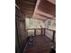 Outdoor porch offers lattice railing with wooded views and a metal security door at 17233 Dalberg Dr, Spring Hill, FL 34610