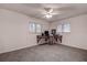 Bright bedroom featuring a ceiling fan, natural light, and a small desk with chair at 2343 Wilshire Dr, Dunedin, FL 34698