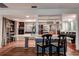 Kitchen area with wood-look floors, breakfast bar, and stainless steel appliances at 2343 Wilshire Dr, Dunedin, FL 34698