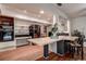 Spacious kitchen area with island, open shelving, and modern appliances for cooking and dining at 2343 Wilshire Dr, Dunedin, FL 34698