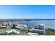 Scenic aerial view showcases the city skyline over calm water and the community below at 2506 N Rocky Point Dr # 242, Tampa, FL 33607