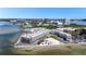 Gorgeous aerial view of waterfront condos with beach access, volleyball court, and boat dock at 2506 N Rocky Point Dr # 242, Tampa, FL 33607