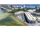 Aerial view of waterfront condos with a swimming pool overlooking the bay and the city skyline at 2506 N Rocky Point Dr # 242, Tampa, FL 33607