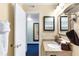 Full bathroom includes a vanity with granite countertop and shower-tub combination at 2506 N Rocky Point Dr # 242, Tampa, FL 33607