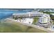 Aerial view of beach volleyball court, waterfront condos, and dock on the beach at 2506 N Rocky Point Dr # 242, Tampa, FL 33607