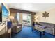 Inviting living room with plush seating, tv and balcony at 2506 N Rocky Point Dr # 242, Tampa, FL 33607
