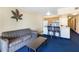 Living room offering a comfortable sofa, breakfast bar, and decor at 2506 N Rocky Point Dr # 242, Tampa, FL 33607