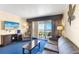 Comfortable living room with ocean view, sleeper sofa, TV, and balcony access at 2506 N Rocky Point Dr # 242, Tampa, FL 33607