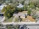 A home with a driveway, small shed, and mature trees, close to the street at 2606 N Boulevard, Tampa, FL 33602
