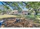 Large backyard with patio space and mature trees providing shade at 2606 N Boulevard, Tampa, FL 33602