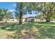Spacious backyard with mature trees, providing a serene and private outdoor space at 2606 N Boulevard, Tampa, FL 33602