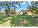 Expansive backyard featuring well-maintained lawn and mature trees, perfect for outdoor enjoyment at 2606 N Boulevard, Tampa, FL 33602