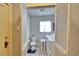 Practical bathroom with toilet, utility sink, and a laundry machine, offering convenience and functionality at 2606 N Boulevard, Tampa, FL 33602