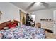 Comfortable bedroom with floral bedding, a dresser, and personal items creating a lived-in feel at 2606 N Boulevard, Tampa, FL 33602
