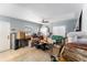 The living room has a ceiling fan, tiled floors, and natural light coming through the window at 265 115Th Ave, Treasure Island, FL 33706