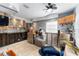 View of living room features tiled floors, stone walls, and wooden cabinets at 265 115Th Ave, Treasure Island, FL 33706