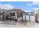 Back of home featuring a unique spiral staircase and access to a fenced outdoor space at 265 115Th Ave, Treasure Island, FL 33706