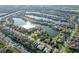Community aerial view featuring lakefront homes and lush green landscaping at 2769 Harvest Drive, Sarasota, FL 34240