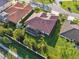 Lovely aerial view of a home with a screened-in lanai and lush backyard at 2769 Harvest Drive, Sarasota, FL 34240