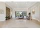 Spacious living room with a decorative stone wall and large sliding glass doors at 2769 Harvest Drive, Sarasota, FL 34240