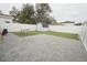 Spacious backyard with a shed, a patio area, and a white privacy fence at 302 N Lauber Way, Tampa, FL 33609