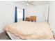 Bedroom with window and ceiling fan and blue curtains at 302 N Lauber Way, Tampa, FL 33609