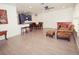 Spacious living room featuring wood flooring, with natural light and comfortable seating at 302 N Lauber Way, Tampa, FL 33609
