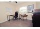 Cozy home office features a whiteboard, desk, chair, and lots of natural light at 302 N Lauber Way, Tampa, FL 33609