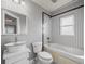Bathroom featuring a vanity sink and bathtub with unique tiled walls at 3447 Flamingo Blvd, Hernando Beach, FL 34607